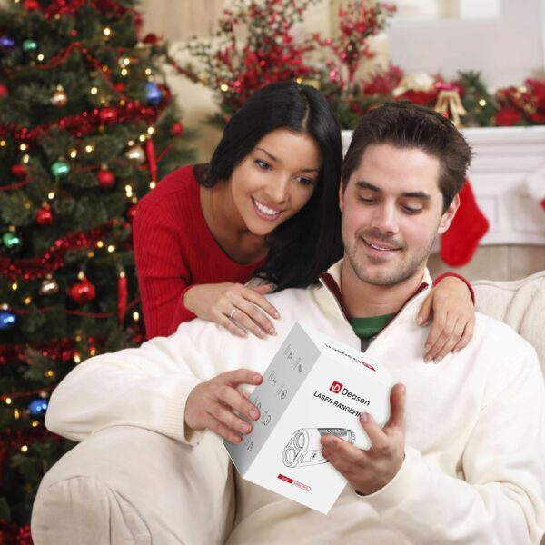 Couple Celebrating Christmas with a Deason Laser Rangefinder Gift Under a Decorated Tree