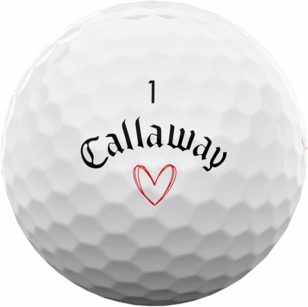 Close-up of a Callaway golf ball featuring a black brand name, a red heart design, and the number 1 identifier