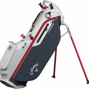 Callaway stand golf bag featuring foldable red legs, navy blue and white design with red accents, multiple compartments, and an American flag decoration