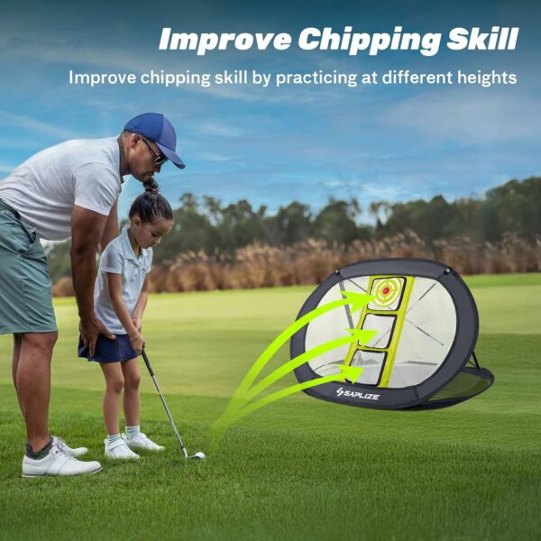 Man teaching a child golf chipping with a portable chipping net on a grassy field