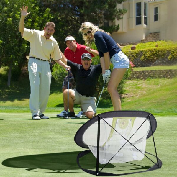 Group of people practicing golf with a portable practice net on a green golf course