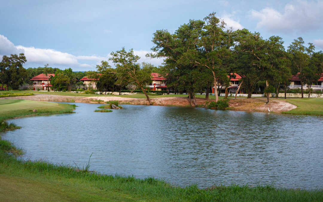 Lagoon and resort villas beside a fairway at Laguna Golf Phuket, Thailand